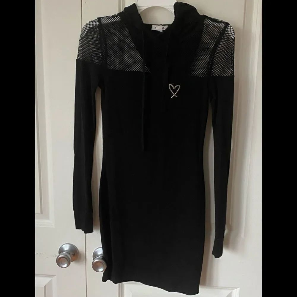 Hooded Black Dress
Garage